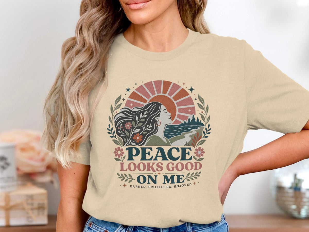 "Peace Looks Good On Me" graphic tee with a woman and nature scene.