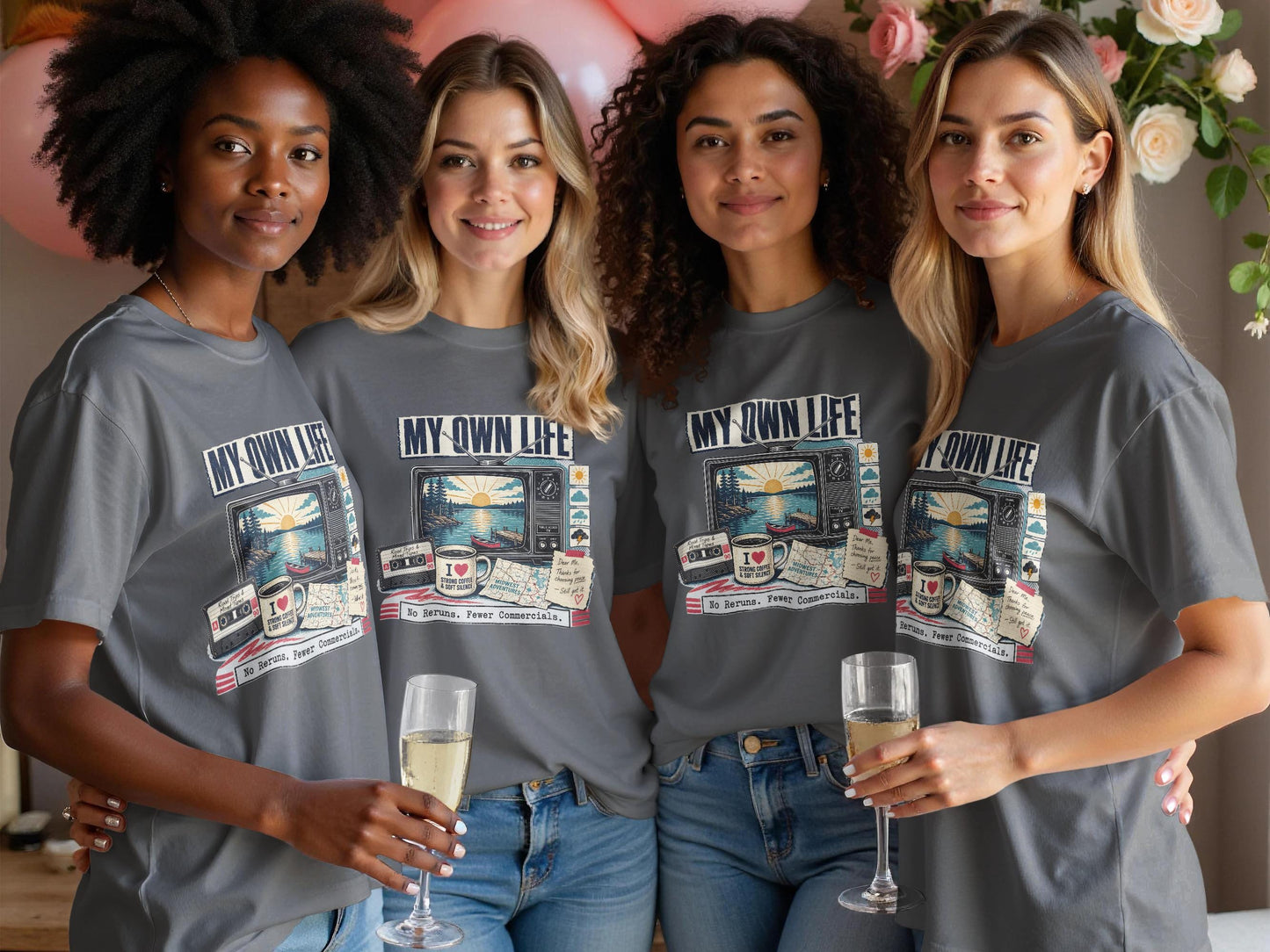 Four women wear grey t-shirts with a vintage TV graphic and text.