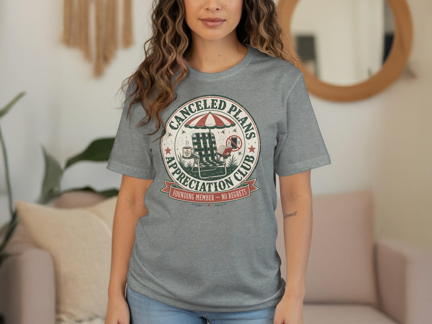 Gray t-shirt with "Canceled Plans Appreciation Club" circular graphic.