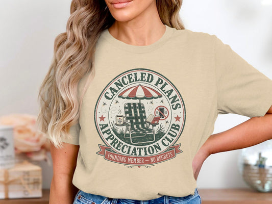 T-shirt with "Canceled Plans Appreciation Club" graphic featuring a chair and umbrella.