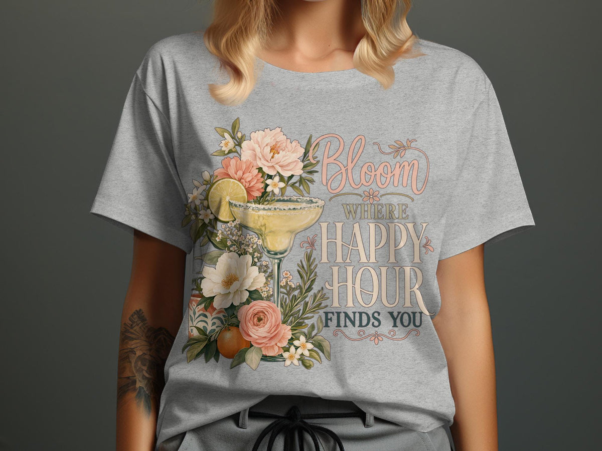 Grey t-shirt with margarita, flowers, and text "Bloom Where Happy Hour Finds You".