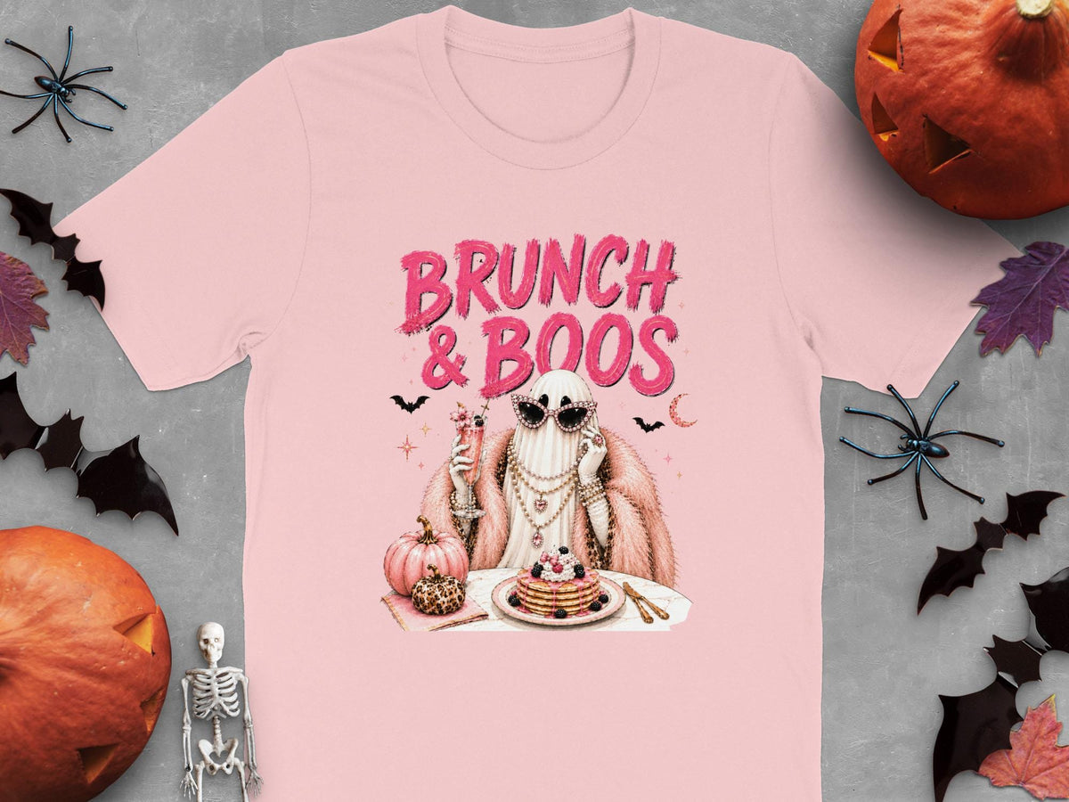 Pink t-shirt with "Brunch & Boos" text and a glamorous ghost eating pancakes.