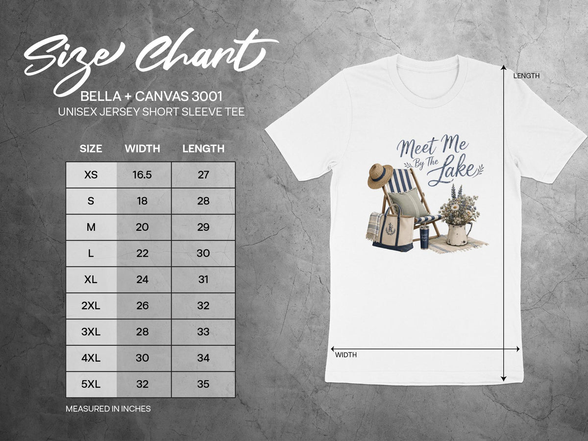 T-shirt graphic with "Meet Me By The Lake" text, beach chair, tote, and flowers.